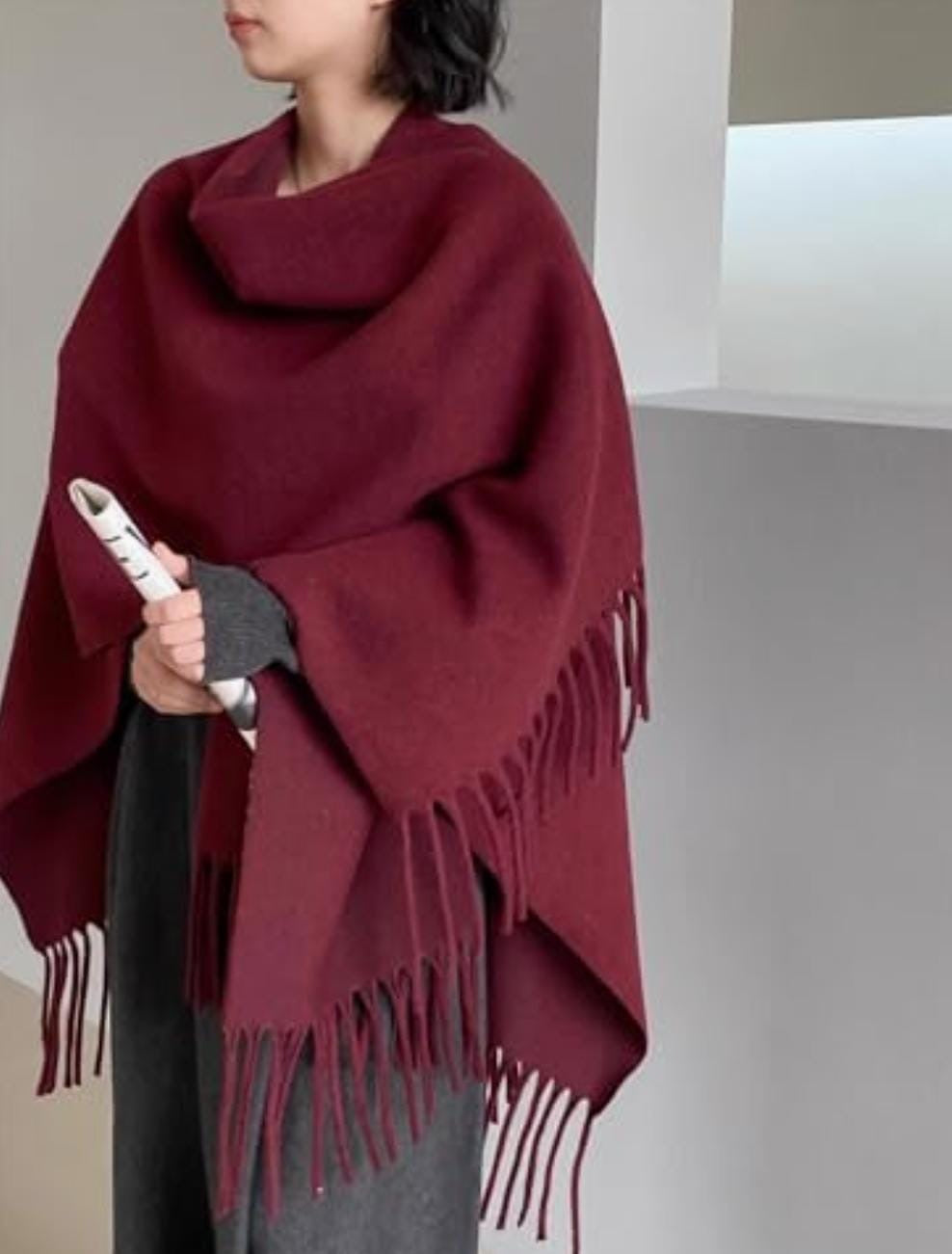 A solid burgundy/wine poncho-style shawl or cape