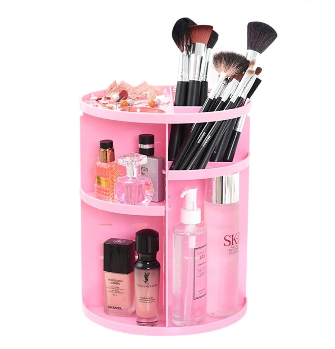 A pink rotating cosmetics and skincare organizer.